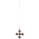 A SILVER PENDANT BY GEORG JENSEN, CIRCA 1915-19, of stylised cross design, set with cabochon