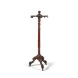 A WILLIAM IV MAHOGANY HAT AND COAT STAND, c.1830, with turned globular finial, and circular brass