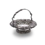 A 19TH CENTURY WHITE METAL CIRCULAR FRUIT BASKET, pierced and cast with all-over leaf, scroll and