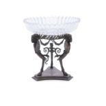 A LATE VICTORIAN ELKINGTON & CO SILVER PLATED TABLE STAND, the circular top supported on three neo-