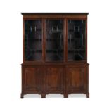 A 19TH CENTURY MAHOGANY TRIPLE DOOR BOOKCASE, with moulded dentil cornice above astragal glazed