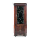 A GEORGE III MAHOGANY CORNER CABINET, with Greek key and dentil cornice above a single astragal