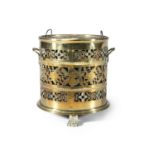 A VICTORIAN CYLINDRICAL COAL BUCKET with pierced foliate and geometric banding, with zinc liner,