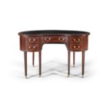AN EDWARDIAN MAHOGANY KIDNEY-SHAPED WRITING DESK, with leather inset top above a recessed central