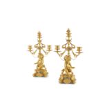 A PAIR OF 19TH CENTURY ORMOLU FIGURAL CANDELABRA, inset with small oval Sèvres style porcelain