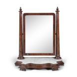 A VICTORIAN MAHOGANY CRUTCH FRAME TOILET MIRROR, C.1870, with adjustable rectangular plate,