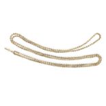 A GOLD ALBERT LONG CHAIN, the long fancy-link gold chain mounted in 14K gold, length 158cm, approx