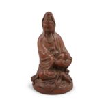 A CHINESE CARVED BOXWOOD FIGURE OF A SEATED GUANYIN, 19th century, modelled with one leg bent at the