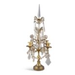 A 19TH CENTURY BRASS AND CUT GLASS TIERED CANDELABRUM, with pointed glass finial, above two tiers of