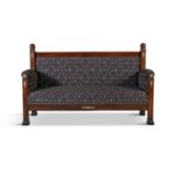 A FRENCH EMPIRE STYLE MAHOGANY FRAMED SETTEE IN THE EGYPTIAN TASTE, 19th century, the rectangular