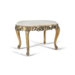 A 19TH CENTURY CARVED GILTWOOD STOOL, of oval form, with padded seat, above a carved pierced