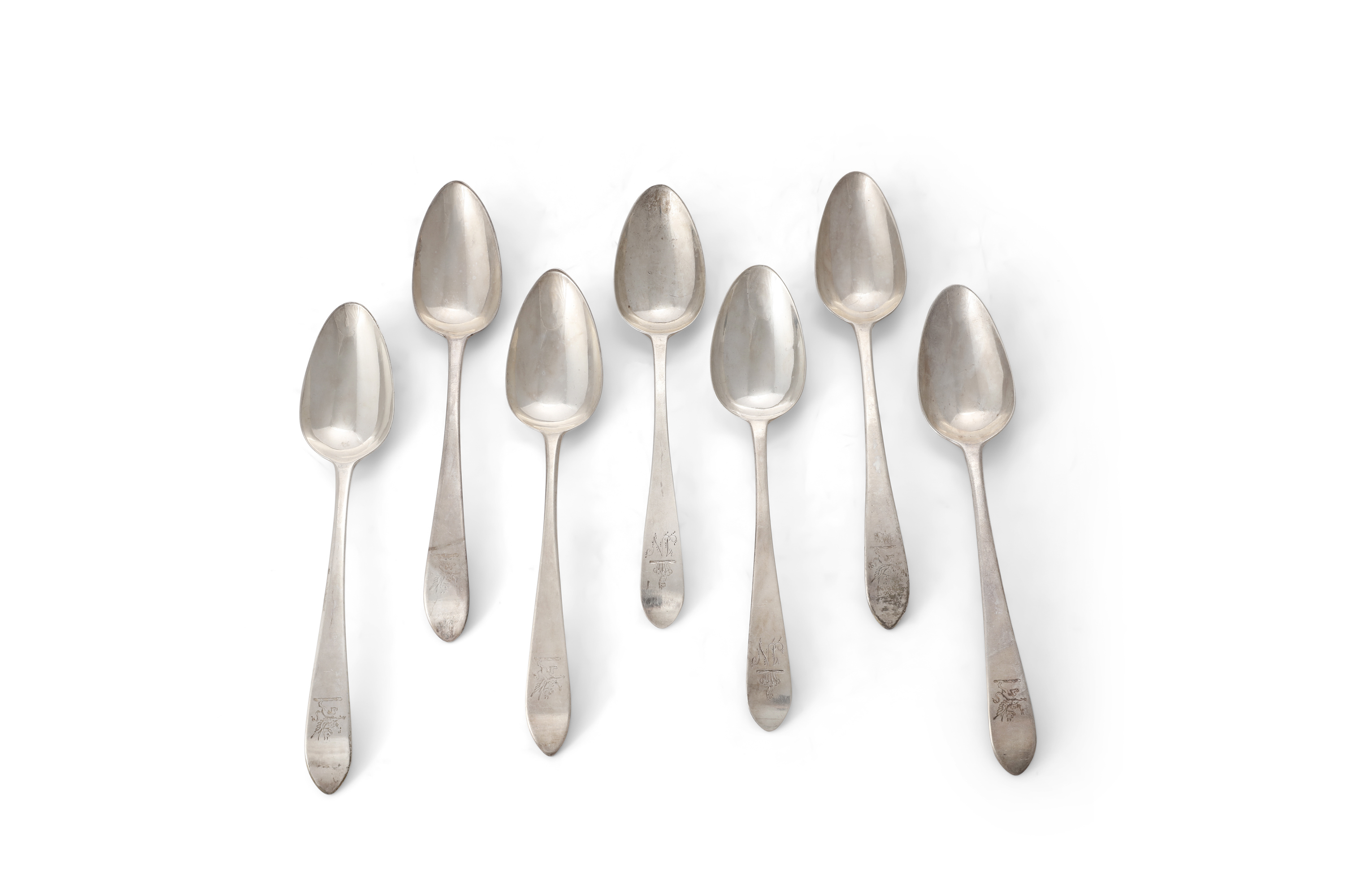 A MATCHED SET OF SEVEN IRISH GEORGIAN SILVER PLAIN TAPER HANDLED POINT-END SOUP SPOONS, all