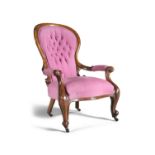 A VICTORIAN MAHOGANY FRAMED OPEN ARMCHAIR with waisted back, covered in pink buttoned back