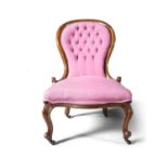 A VICTORIAN MAHOGANY FRAMED OCCASIONAL CHAIR, upholstered in buttoned pink cotton, and with