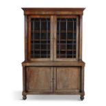 A 19TH CENTURY FADED MAHOGANY BOOKCASE, with plain moulded cornice above twin astragal glazed