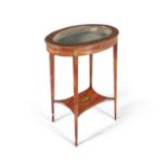 A GEORGE III STYLE PAINTED SATINWOOD OVAL CURIO TABLE, with glazed top, decorated with garlands of