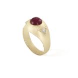 A RUBY AND DIAMOND GYPSY RING, the yellow gold mount set with a ruby cabochon, between triangular-