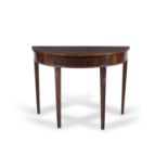 A GEORGE III MAHOGANY SEMI-ELLIPTICAL SIDE TABLE, the d-shaped top raised above a plain frieze and