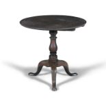 A GEORGE III MAHOGANY CIRCULAR SUPPER TABLE, with cavetto top raised on turned centre pillar