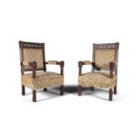 A PAIR OF 19TH CENTURY GOTHIC REVIVAL OAK CHAIRS, in the the manner of Pugin. 109 cm high, 61 cm