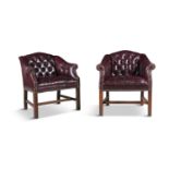 A PAIR OF BUTTON BACK LEATHER CLUB CHAIRS, early 20th century, each with square backs and scroll