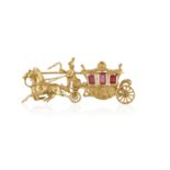 A GOLD AND SYNTHETIC RUBY NOVELTY BROOCH, designed as a horse-drawn carriage with textured gold