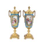 A PAIR OF 19TH CENTURY ORMOLU AND SÈVRES STYLE PORCELAIN CASSOLETTES, painted with panels