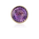 AN AMETHYST COCKTAIL RING, 1970, collet-set with a round mixed-cut amethyst, accented with ropetwist