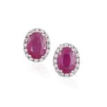 A PAIR OF RUBY AND DIAMOND EARSTUDS, each oval-shaped ruby within a surround of brilliant-cut