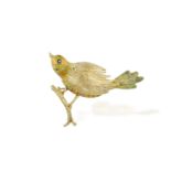 A GOLD AND ENAMEL NOVELTY BROOCH, the textured gold bird with green and orange enamel on the head