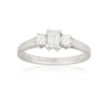 A SINGLE-STONE DIAMOND RING, the rectangular-cut diamond between brilliant-cut diamond shoulders, to