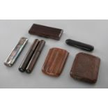 AN ASSORTED COLLECTION OF CIGAR BOXES, comprising of three leather cases as well as two wooden