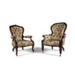 A PAIR OF LADY'S AND GENTLEMAN'S MAHOGANY FRAMED ARMCHAIRS, c.1870, each upholstered in matching