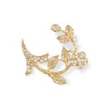 A DIAMOND FLOWER BROOCH, the stylised flower with textured gold stem, the petals and leaves set with