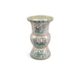 A LARGE CHINESE FAMILLE ROSE VASE, 19th century, of flared design, with lobed central section and