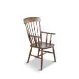 A BEACH AND ELMWOOD WINDSOR CHAIR, with seven-bar rack, curved top rail and moulded seat, on