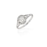 A DIAMOND RING, the brilliant-cut diamond set within an openwork of foliate design, to a plain hoop,