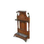 A VICTORIAN OAK AND BRASS MOUNTED HALL STAND, c.1880, attributed to Shoolbred with brass rosette