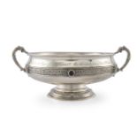 A CELTIC REVIVAL SILVER TWO-HANDLED CIRCULAR DISH, Dublin 1925, mark of West & Sons, engraved with