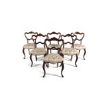 A SET OF SIX VICTORIAN ROSEWOOD BALLOON BACK DINING CHAIRS, the seats upholstered in cream damask