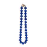 A LAPIS-LAZULI BEAD NECKLACE, composed of a single row of round lapis-lazuli beads, to a spherical