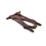 A VICTORIAN MAHOGANY BOOT JACK, 55 cm high, 33 cm wide