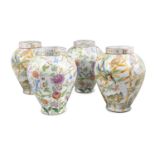 A PAIR OF MODERN CONTINENTAL CHINA URNS AND COVERS, of baluster form, decorated with toucans and