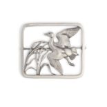 A SILVER BROOCH BY GEORG JENSEN, the rectangular-shaped frame enclosing a stylised bird in flight,