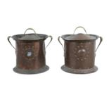 A MATCHED PAIR OF CYLINDRICAL COPPER COAL BUCKETS, the circular domed lids with brass handle and