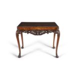 A WALNUT QUARTER VENEERED SIDE TABLE, early 20th century, of rectangular shape, with shell carved