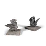 A PAIR OF HEAVY CAST IRON MOUNTS, 19th century, formed as a pair of nesting eagles, on a square