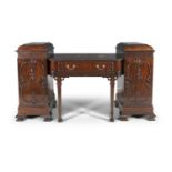 AN EDWARDIAN MAHOGANY TWIN PEDESTAL SIDEBOARD, in 'Chinese Chippendale' taste, the breakfront top