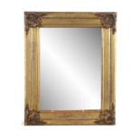 A PAIR OF GILTWOOD AND GESSO WALL MIRRORS, the rectangular mirrored plate contained within plain