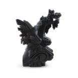A LARGE CARVED OAK MODEL OF A WINGED GARGOYLE, 18th century, modelled perched on a scrollwork